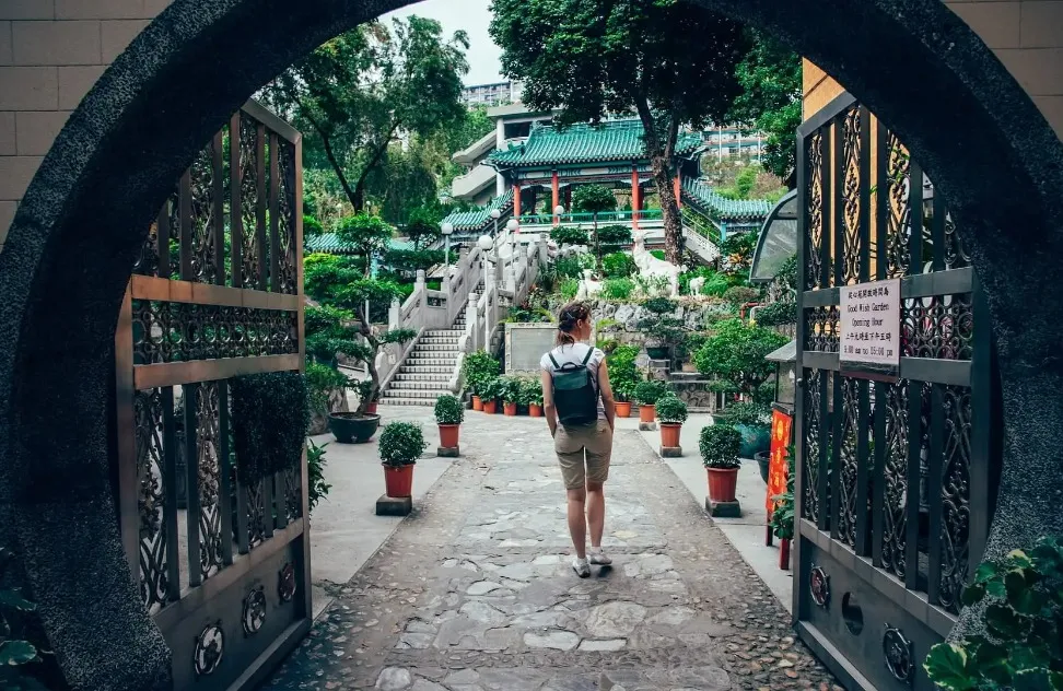 A lady walking in pathway at daytime