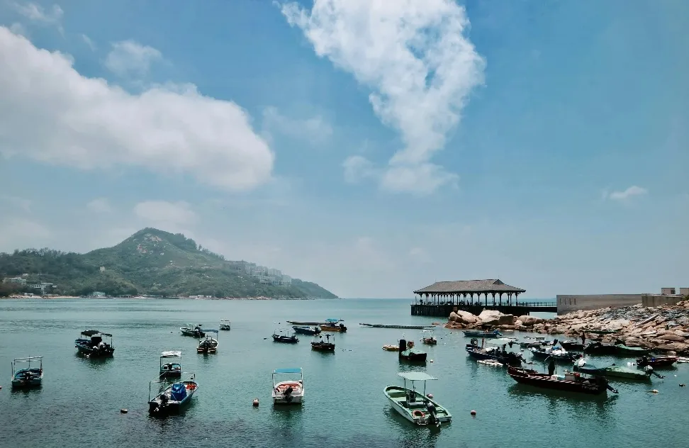 Boats on Body of Water Under Blue Sky