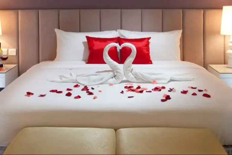 Rose petal decor and bed setup at Silka Cheras Suite