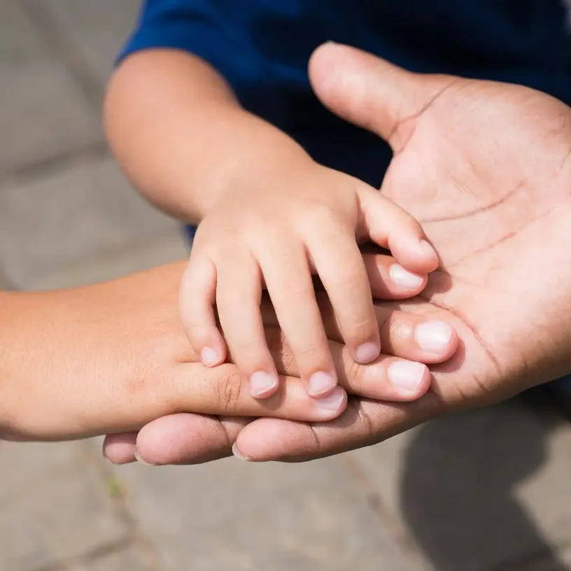 Closeup of family hands together