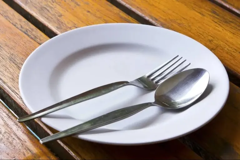 Cutlery set neatly arranged on a plate