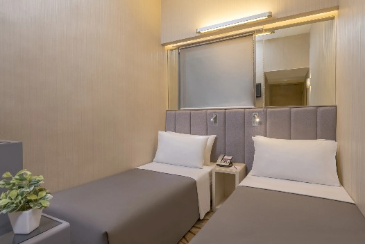 Twin beds with reading lights at Silka Far East Standard Room