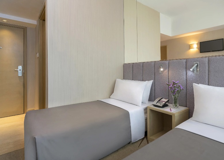 Twin beds with reading lights at Silka Far East Standard Room