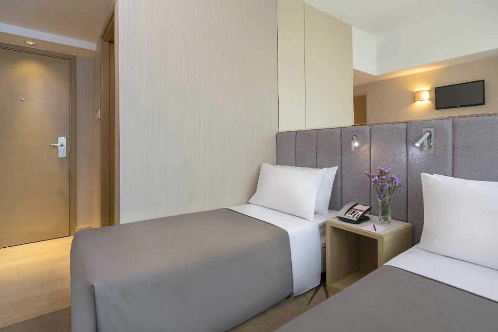 Twin beds with reading lights at Silka Far East Standard Room