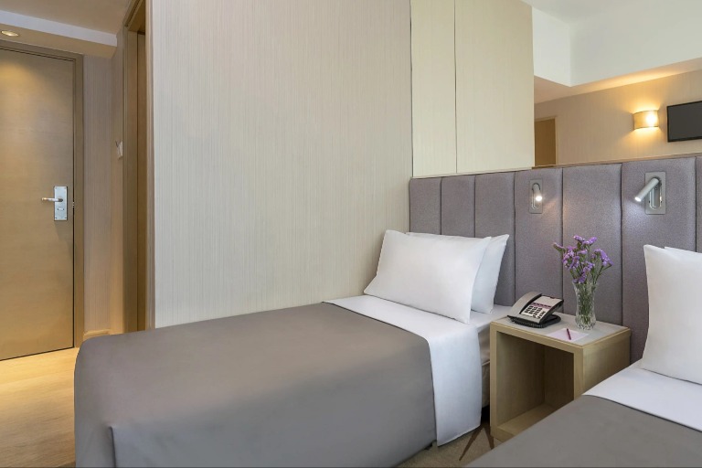 Twin beds with reading lights at Silka Far East Standard Room