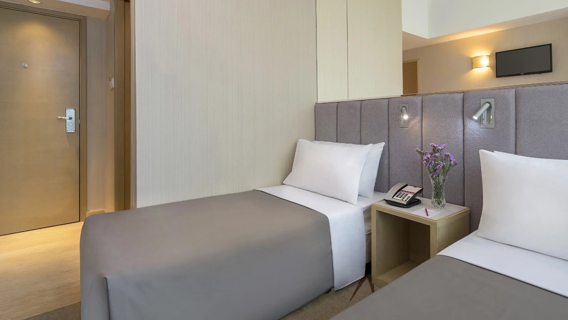 Twin beds with reading lights at Silka Far East Standard Room