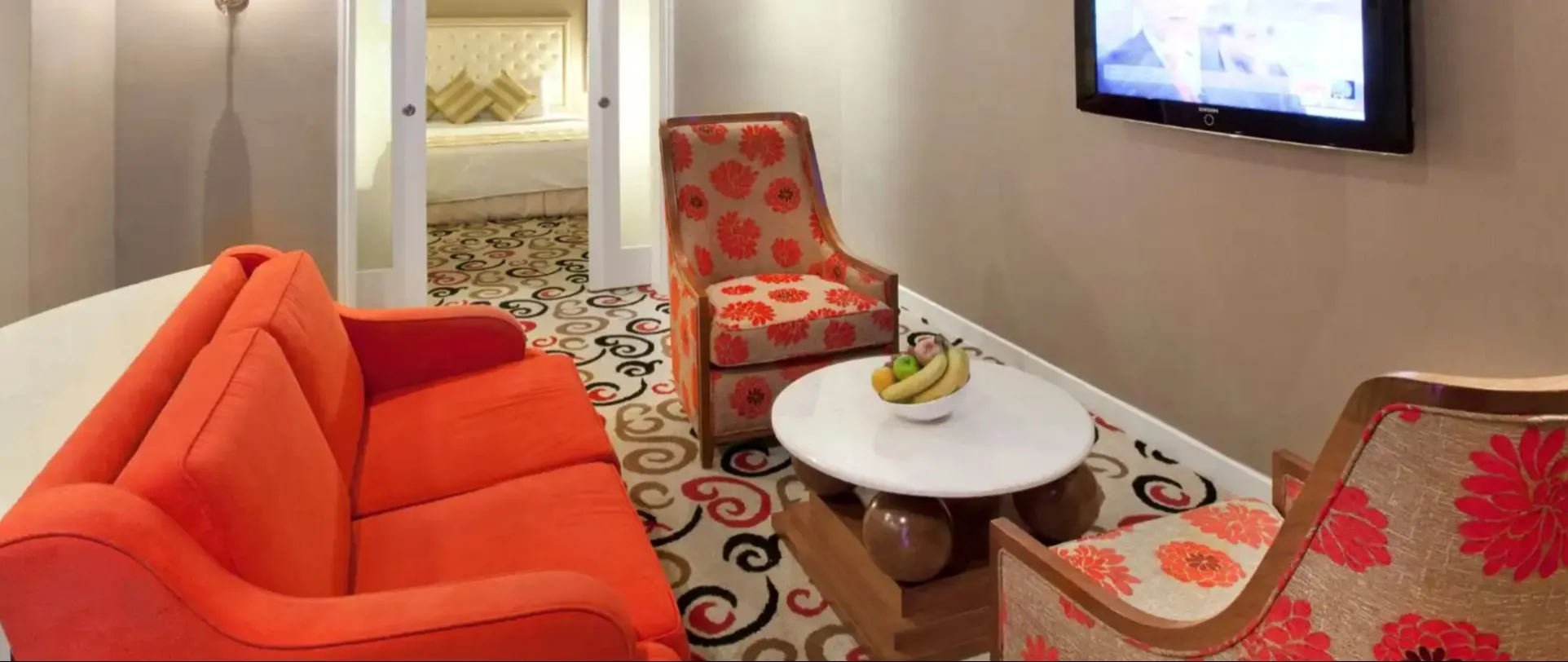 Living area featuring a TV at Silka Maytower Suite