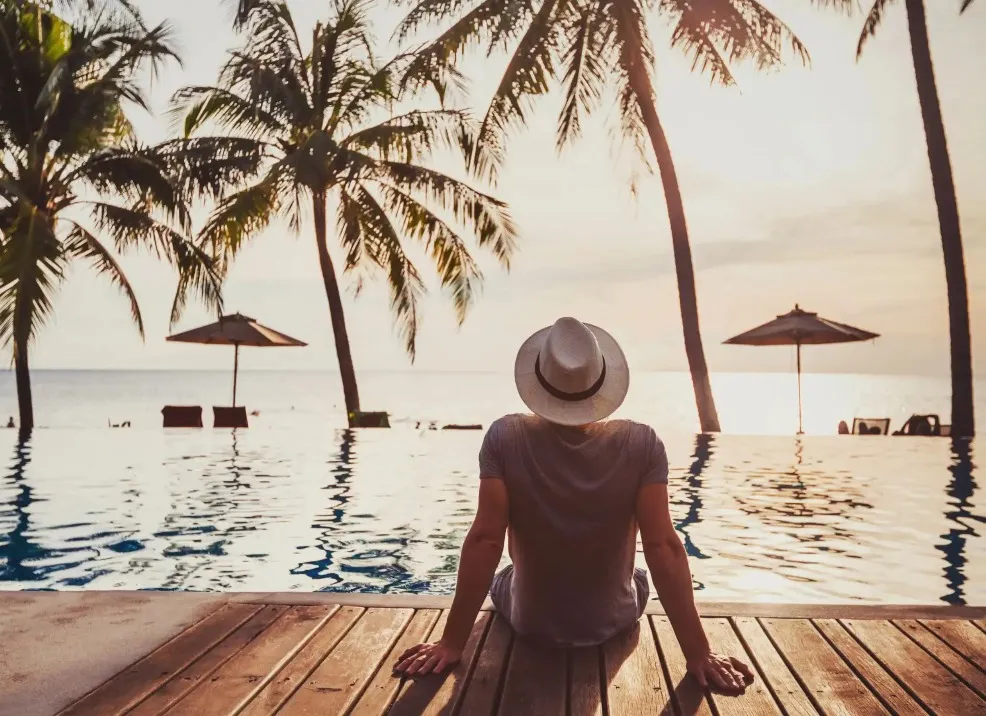 Guest enjoying a beach entry pool area view