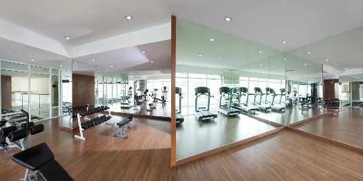 Well-equipped interior at Silka Maytower Hotel gym