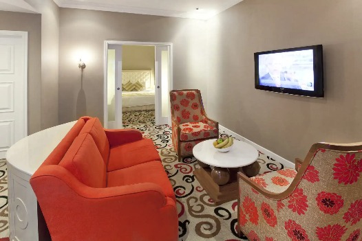 Living area featuring a TV at Silka Maytower Suite