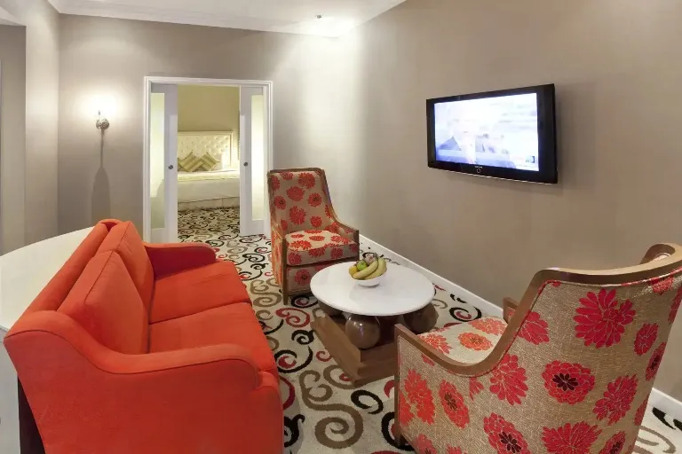 Living area featuring a TV at Silka Maytower Suite