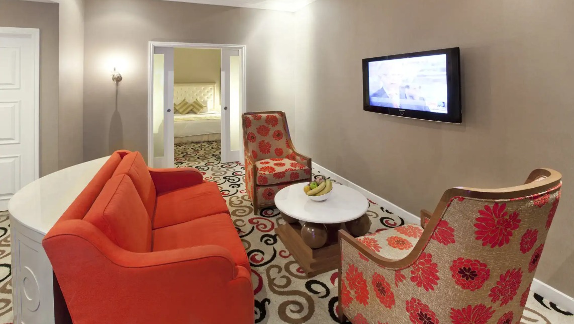 Living area featuring a TV at Silka Maytower Suite