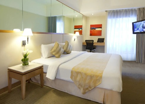 Beds and furnishings at Silka Maytower Standard Room