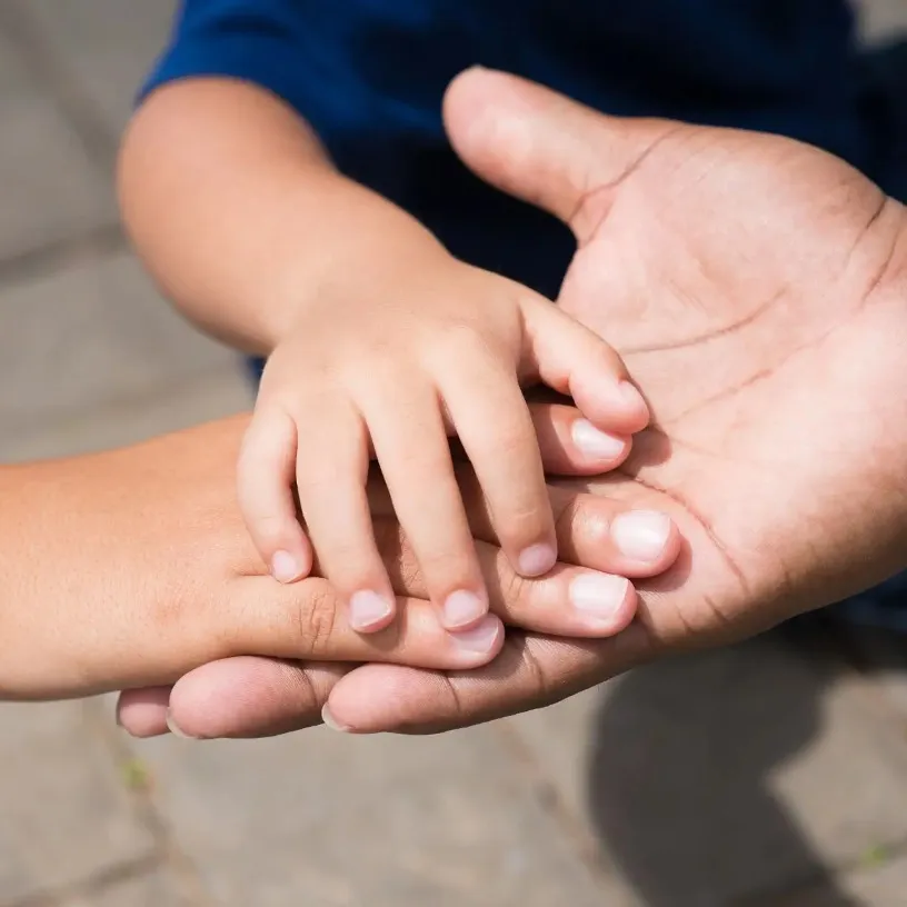 Closeup of family hands together