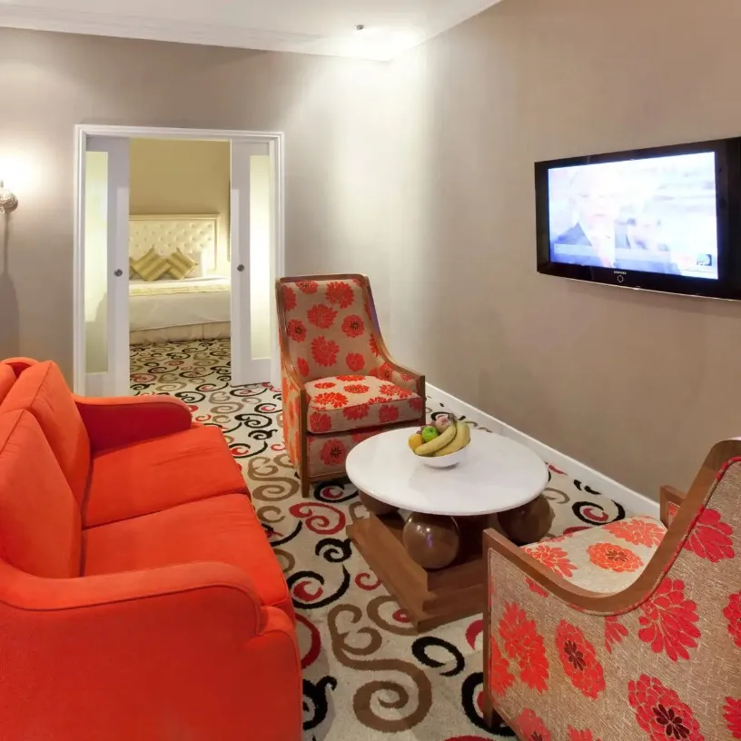 Living area featuring a TV at Silka Maytower Suite