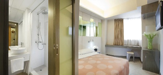 Double bed with ensuite bathroom at Silka Sea View Deluxe Room