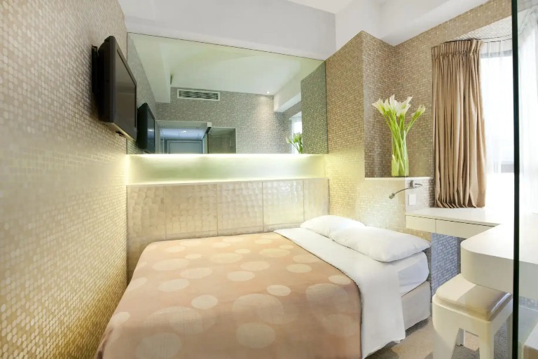 Double bed by window at Silka Sea View Superior Room