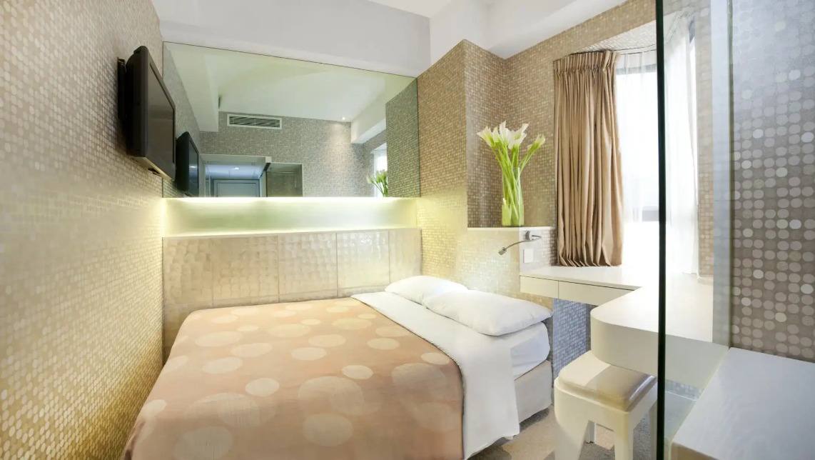 Double bed by window at Silka Sea View Superior Room